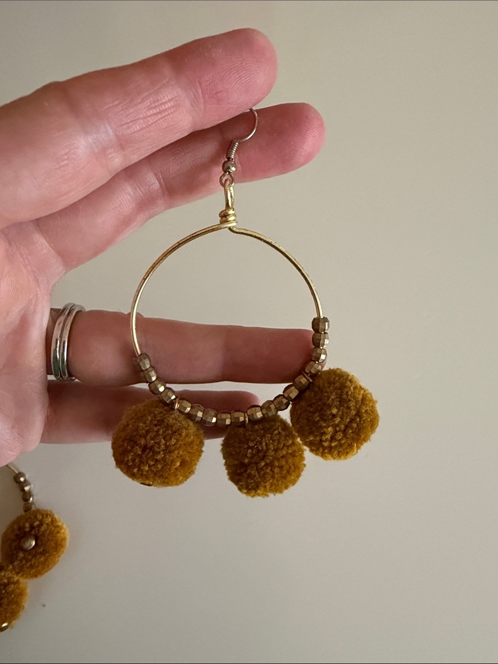 Noonday Collection Gold Hoop Earrings with Mustard Pom-Poms - Picture 2 of 3
